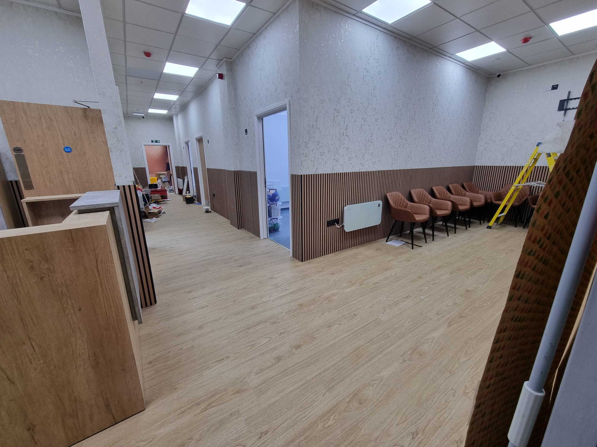 A spacious room with a clean, minimalist aesthetic