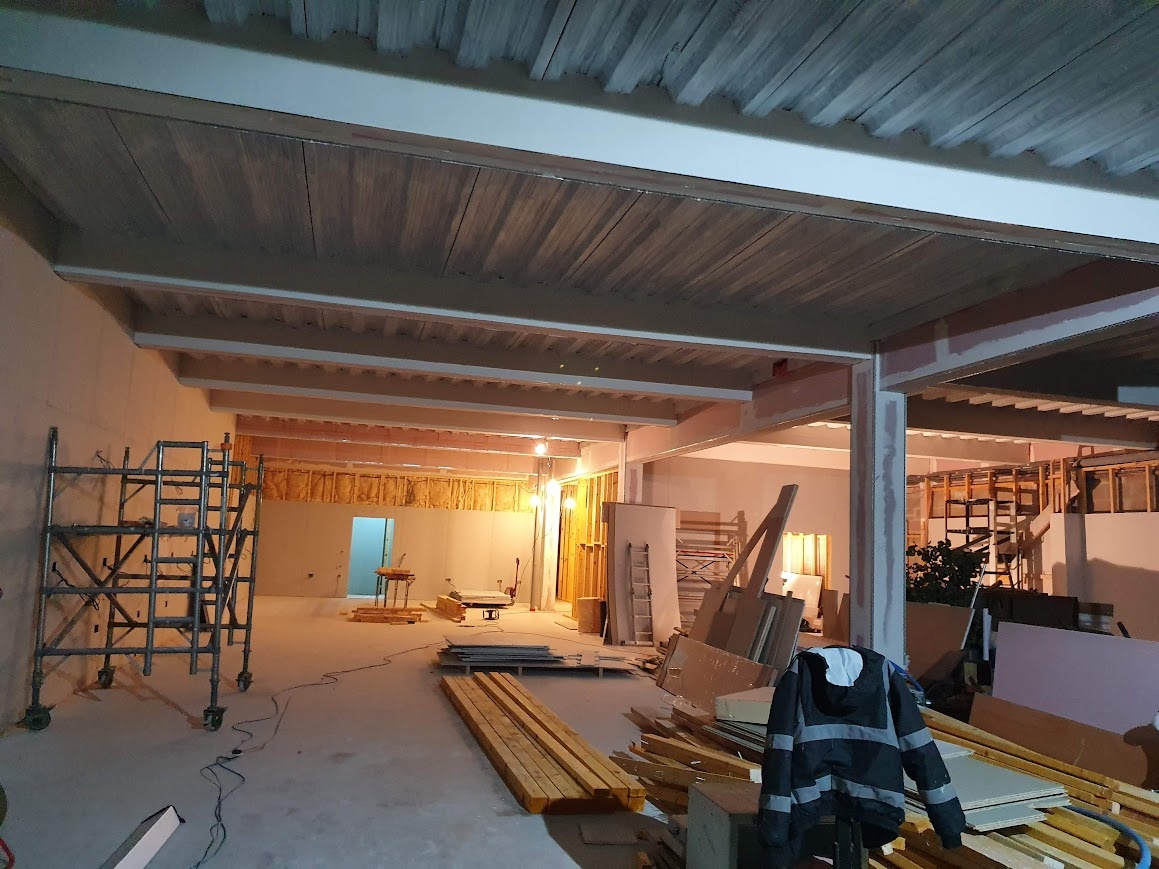 A bustling construction site bathed in the soft glow of daylight